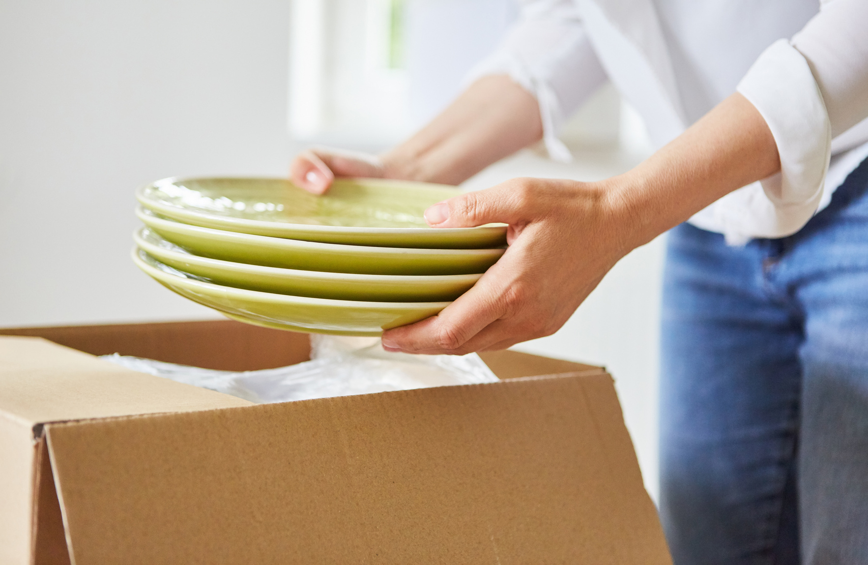 Woman Unpacking or Packing Dishes